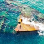 Sunken Ship - Aerial View of Shipwreck in the Middle of Ocean