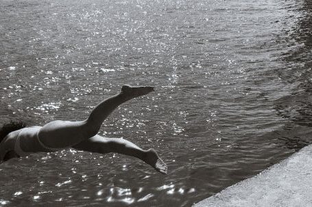 Diving - Grayscale Photography Of Woman Diving Into Water