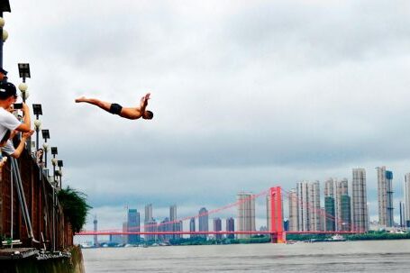 Diving - Man Diving on Body of Water