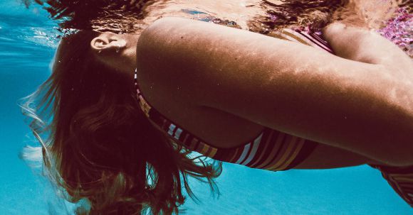 Underwater Camera - Woman in Blue and White Stripe Bikini Top in Water
