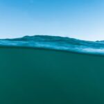 Underwater - body of water under blue sky during daytime