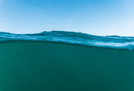 Underwater - body of water under blue sky during daytime