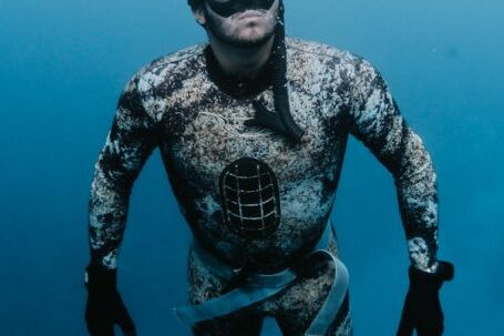 Diving Fins - Man in Drysuit Underwater