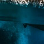 Diving - Blue Water Near White Rocky Mountain