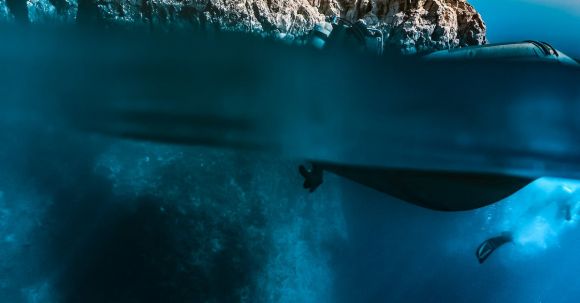 Diving - Blue Water Near White Rocky Mountain