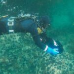 Scuba Diving - A Scuba Diver with an Underwater Scooter