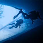 Diving - two person scuba diving in water