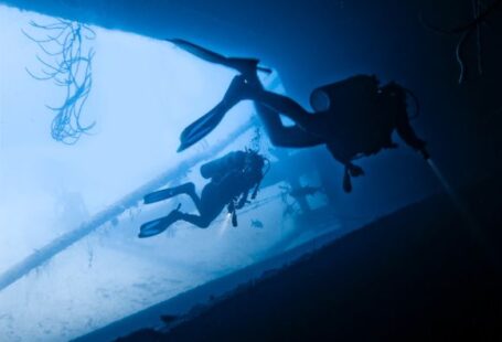 Diving - two person scuba diving in water