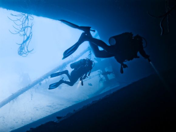 Diving - two person scuba diving in water