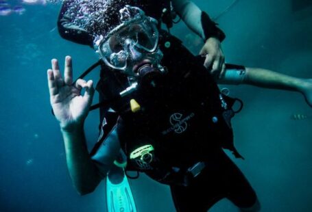 Diving - person wearing diving suit under water