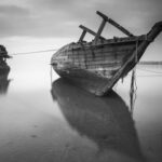 Sunken Ship - 2 Boats on the Body of Water Under Cloudy Sky during Daytime in Greyscale Photo