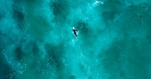 Diving Locations - Aerial Photography of Person Surfing