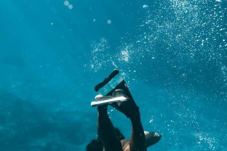 Snorkeling - Woman in Snorkeling Shoes Diving Underwater