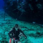 Shipwrecks For Diving - Scuba Diver Posing Near an Old Abandoned Ship Underwater