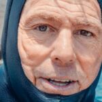 Scuba Diving - A Mam Wearing a Scuba Diving Suit