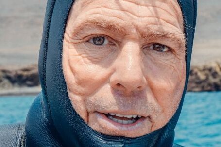 Scuba Diving - A Mam Wearing a Scuba Diving Suit