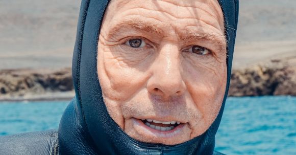 Scuba Diving - A Mam Wearing a Scuba Diving Suit